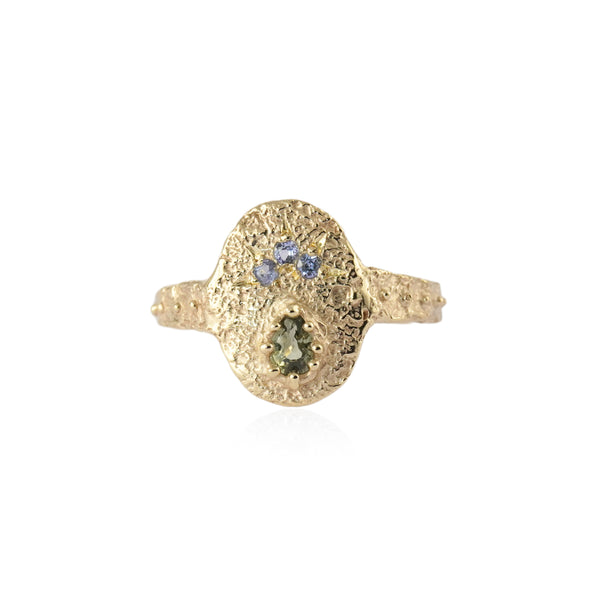 Pear-shaped green sapphire and tanzanite small shield ring